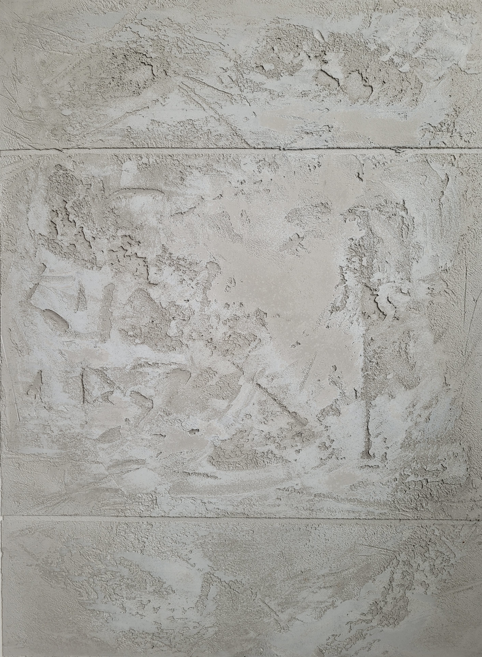 Wandgestaltung in Beton-Imitat, ausgeführt in Spachteltechnik